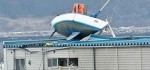 Aufräumen nach dem Japan-Tsunami: Yacht parkt auf zweistöckigem Gebäude